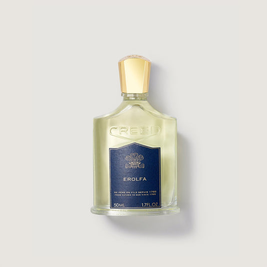 Erolfa Frasco de perfume Creed Erolfa de 50 ml con un tapón dorado en un fondo claro.