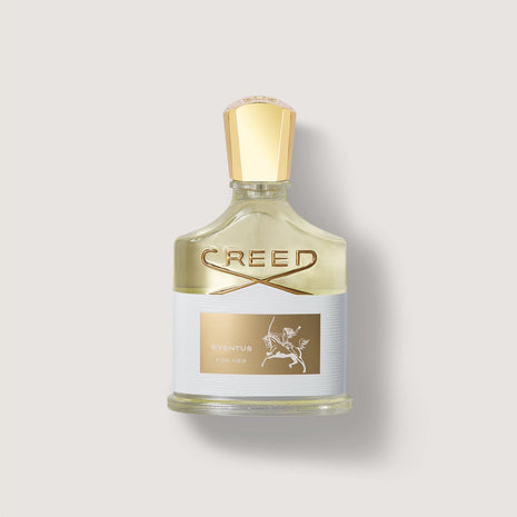 Frasco de perfume Creed Aventus for her con tapón dorado