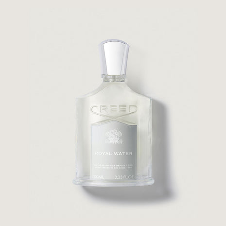 Frasco de perfume Creed Royal Water de 100 ml en un fondo beige claro.